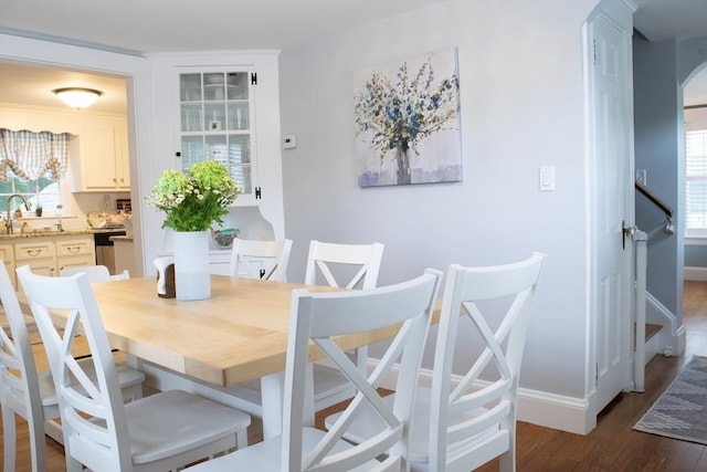 24 Garey St, Weymouth, MA 02189 - dining space with dark wood-type flooring and arched walkways