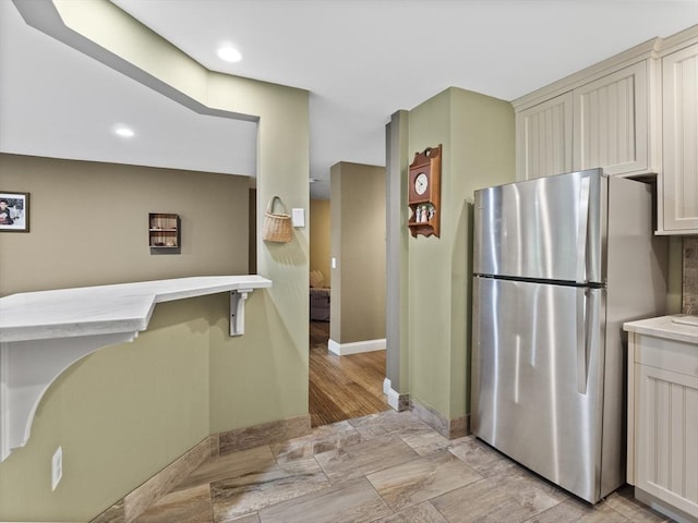 770 Salisbury Unit 302, Worcester, MA 01609 - kitchen with freestanding refrigerator, light countertops, cream cabinetry, and recessed lighting