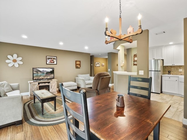 770 Salisbury Unit 302, Worcester, MA 01609 - dining room featuring a chandelier, recessed lighting, and light wood-style flooring