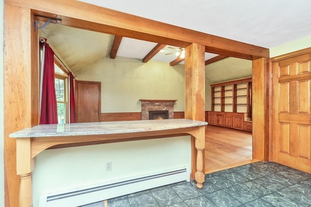10 Eagle Rd, Winchendon, MA 01475 - kitchen with a baseboard heating unit, ceiling fan, light stone counters, and a fireplace