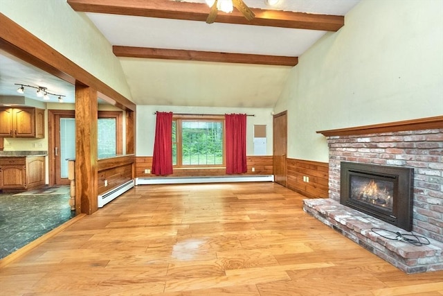 10 Eagle Rd, Winchendon, MA 01475 - unfurnished living room with light wood-style flooring, a brick fireplace, wainscoting, a baseboard heating unit, and ceiling fan