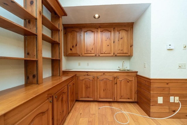 10 Eagle Rd, Winchendon, MA 01475 - kitchen with open shelves, wainscoting, light countertops, a sink, and brown cabinetry