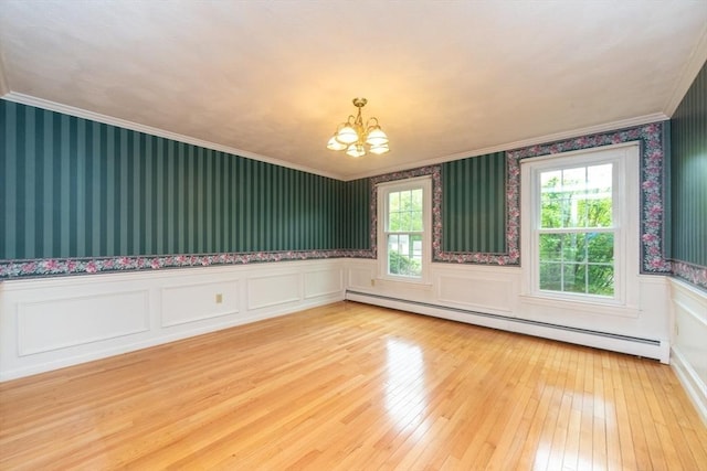 10 Eagle Rd, Winchendon, MA 01475 - empty room featuring baseboard heating, a chandelier, wallpapered walls, healthy amount of natural light, and ornamental molding
