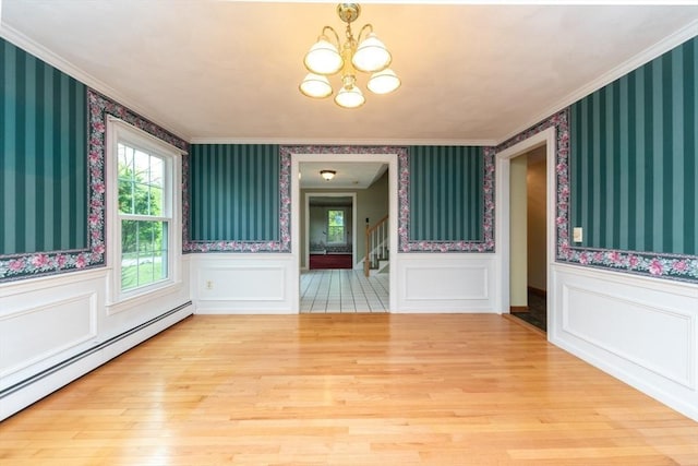 10 Eagle Rd, Winchendon, MA 01475 - unfurnished room with baseboard heating, a chandelier, wallpapered walls, crown molding, and stairs