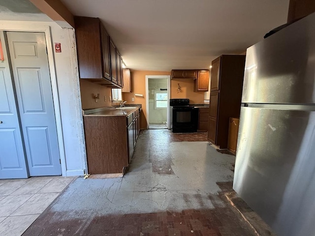 208 Rhode Island Rd, Lakeville, MA 02347 - kitchen with a sink, freestanding refrigerator, and black range with electric cooktop