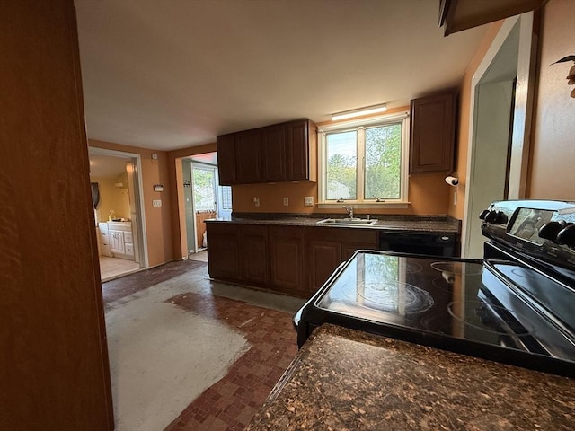 208 Rhode Island Rd, Lakeville, MA 02347 - kitchen featuring a sink, dark countertops, and black appliances
