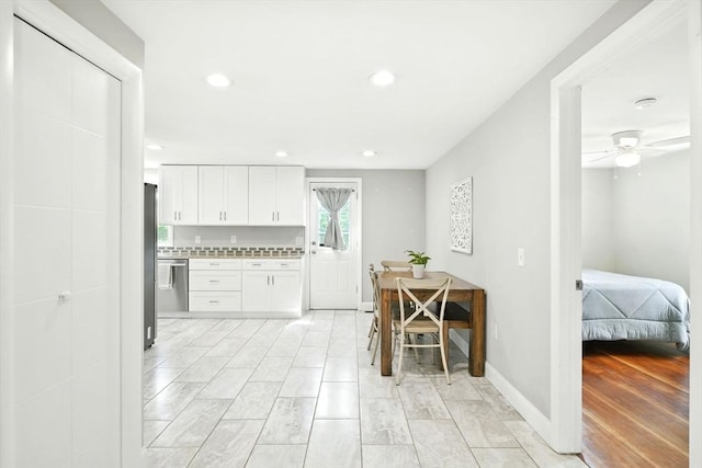 606 Granby Rd, South Hadley, MA 01075 - kitchen featuring white cabinets, light countertops, light wood-style floors, recessed lighting, and stainless steel dishwasher
