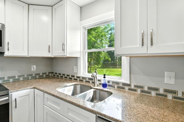 606 Granby Rd, South Hadley, MA 01075 - kitchen featuring white cabinets and light stone countertops