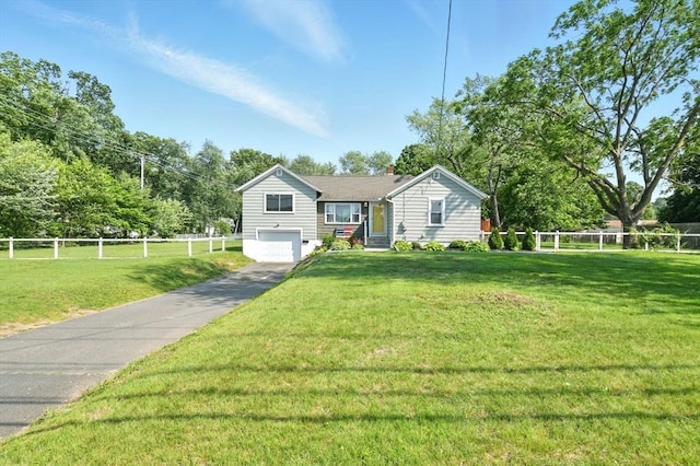 606 Granby Rd, South Hadley, MA 01075 - view of front of house featuring driveway, an attached garage, and a chimney