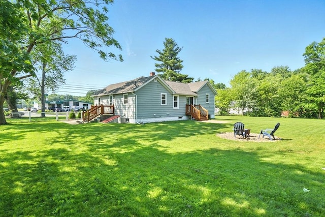 606 Granby Rd, South Hadley, MA 01075 - rear view of house with a fire pit