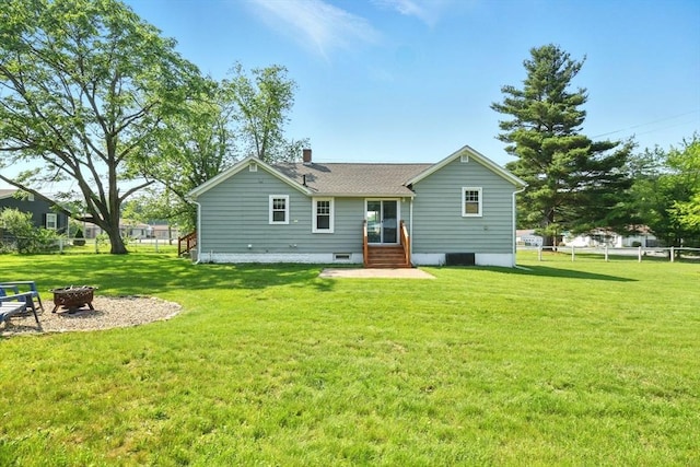 606 Granby Rd, South Hadley, MA 01075 - back of house featuring an outdoor fire pit, a chimney, and entry steps
