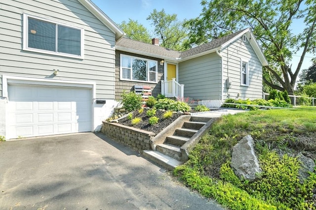 606 Granby Rd, South Hadley, MA 01075 - ranch-style home featuring an attached garage, a chimney, and driveway