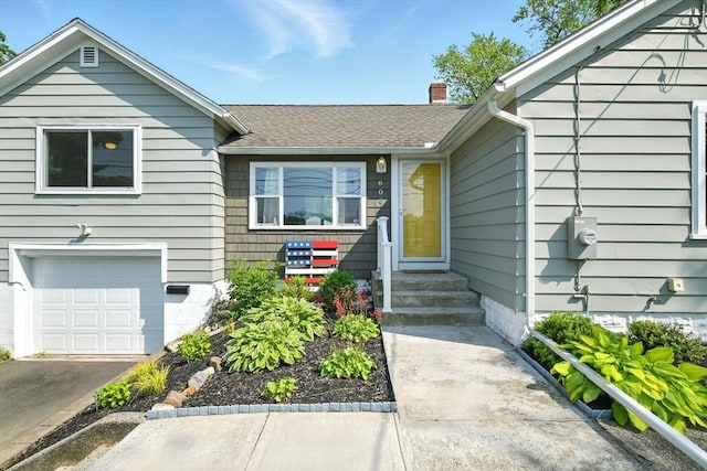 606 Granby Rd, South Hadley, MA 01075 - view of front of property featuring an attached garage, a chimney, concrete driveway, and a shingled roof