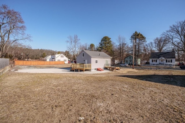 view of yard featuring a deck and fence