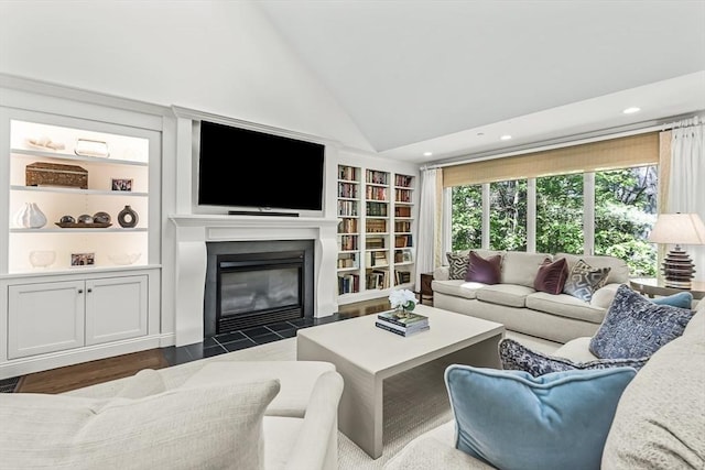 1003 Wisteria Way Unit 1003, Wayland, MA 01778 - living area with vaulted ceiling, built in shelves, a fireplace with flush hearth, recessed lighting, and dark wood-style flooring