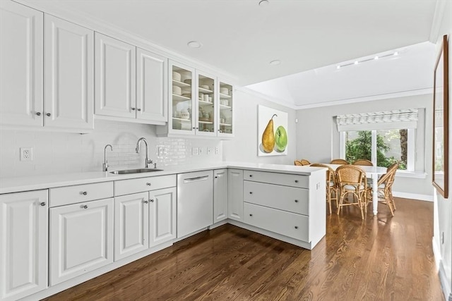 1003 Wisteria Way Unit 1003, Wayland, MA 01778 - kitchen with dishwashing machine, a sink, a peninsula, glass insert cabinets, and light countertops
