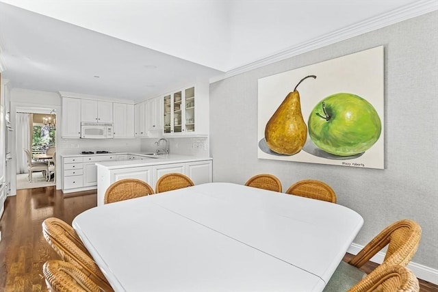 1003 Wisteria Way Unit 1003, Wayland, MA 01778 - dining area with dark wood-type flooring and crown molding