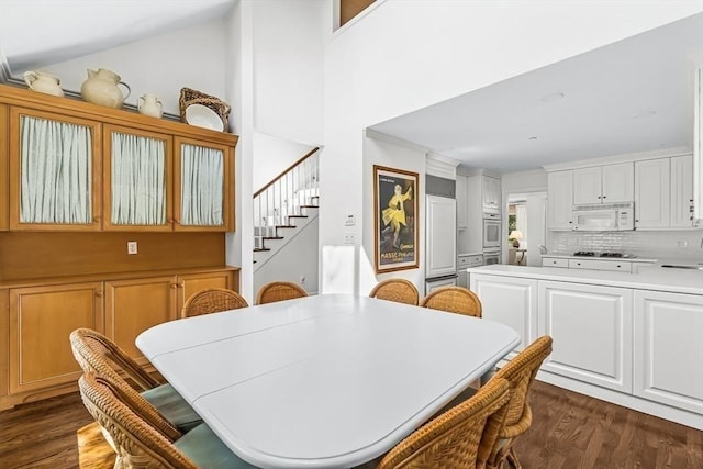 1003 Wisteria Way Unit 1003, Wayland, MA 01778 - dining space with dark wood finished floors, stairway, and a high ceiling