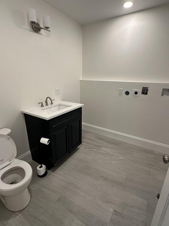 2 Wilkins Pl, Boston, MA 02131 - bathroom with toilet, vanity, baseboards, and recessed lighting