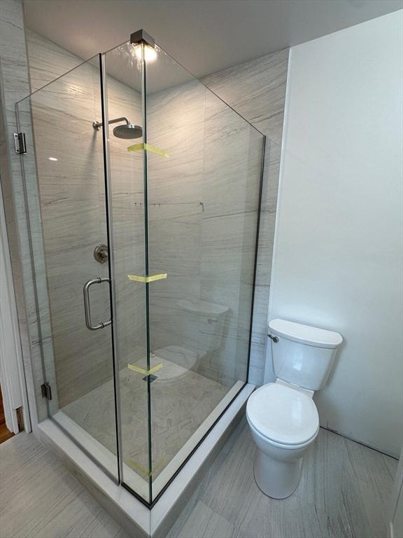 2 Wilkins Pl, Boston, MA 02131 - full bathroom featuring a shower stall and toilet