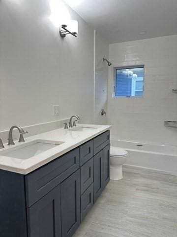2 Wilkins Pl, Boston, MA 02131 - bathroom featuring toilet, washtub / shower combination, and double vanity