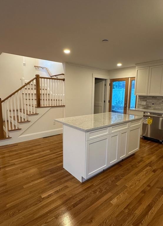 2 Wilkins Pl, Boston, MA 02131 - kitchen featuring stainless steel dishwasher, dark wood-style floors, a center island, white cabinetry, and recessed lighting