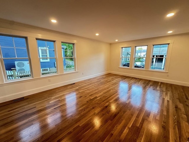 2 Wilkins Pl, Boston, MA 02131 - unfurnished room with ornamental molding, baseboards, wood finished floors, and recessed lighting