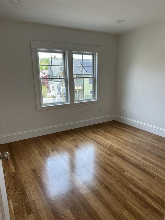 2 Wilkins Pl, Boston, MA 02131 - unfurnished room featuring wood finished floors and baseboards
