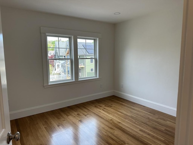 2 Wilkins Pl, Boston, MA 02131 - empty room with wood finished floors and baseboards