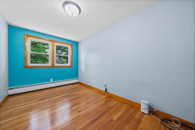 73 Fremont St, Taunton, MA 02780 - empty room featuring a baseboard radiator, wood finished floors, and baseboards