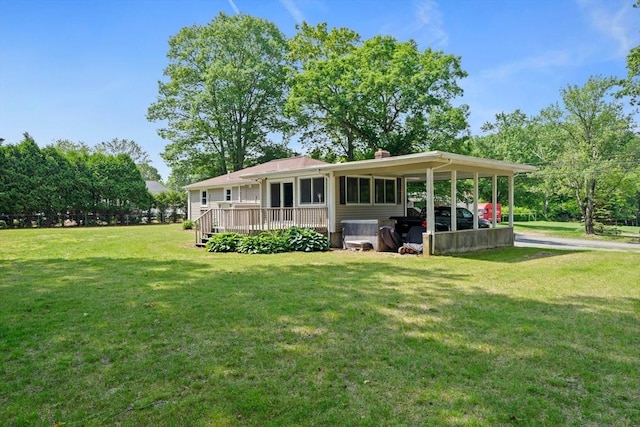 73 Fremont St, Taunton, MA 02780 - view of front of home featuring a front lawn, an attached carport, a deck, and a chimney