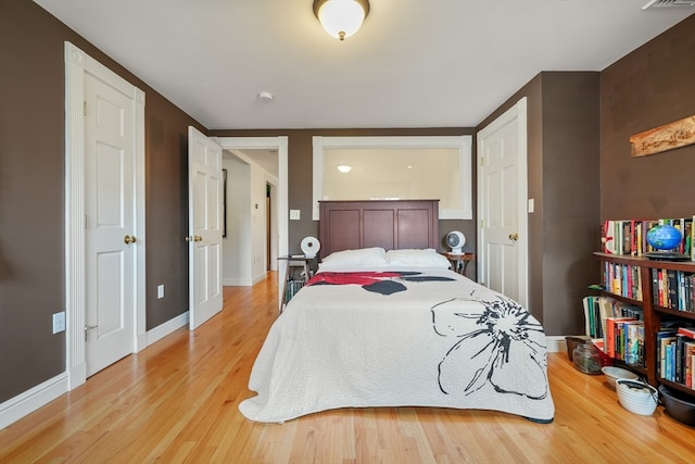 bedroom with light wood-type flooring