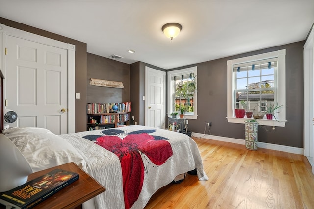 bedroom with light wood-type flooring