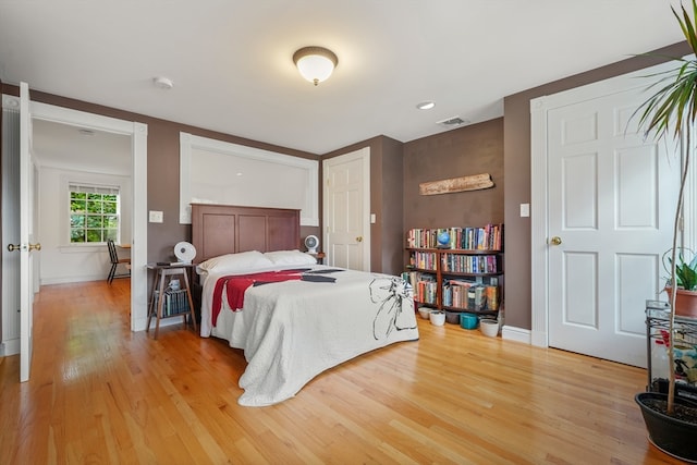 bedroom with light hardwood / wood-style flooring