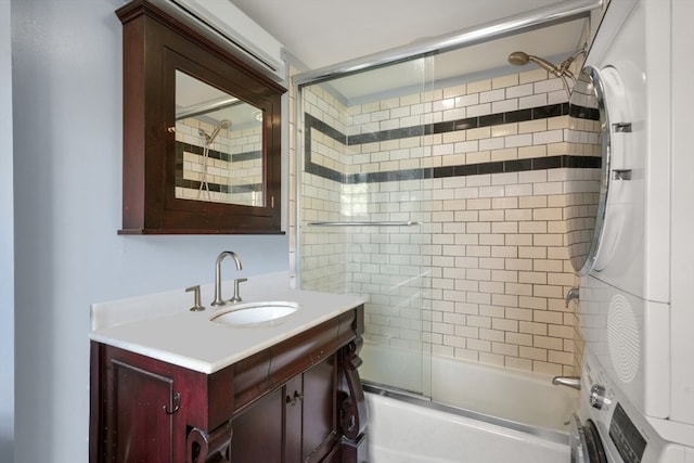 bathroom with vanity and bath / shower combo with glass door