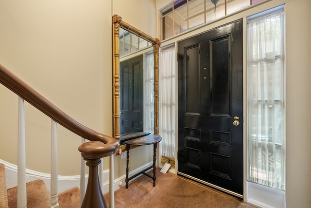 view of carpeted foyer