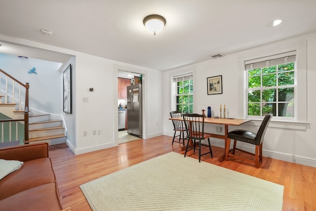 interior space featuring a healthy amount of sunlight and light hardwood / wood-style floors