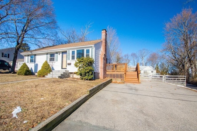 view of front of property with a wooden deck