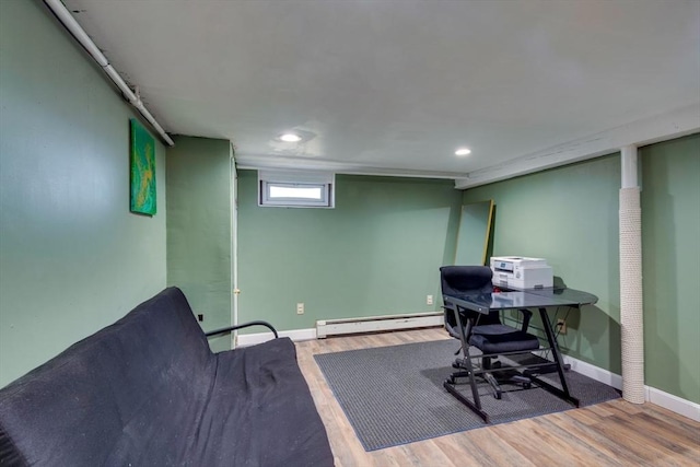 office space with hardwood / wood-style flooring and baseboard heating