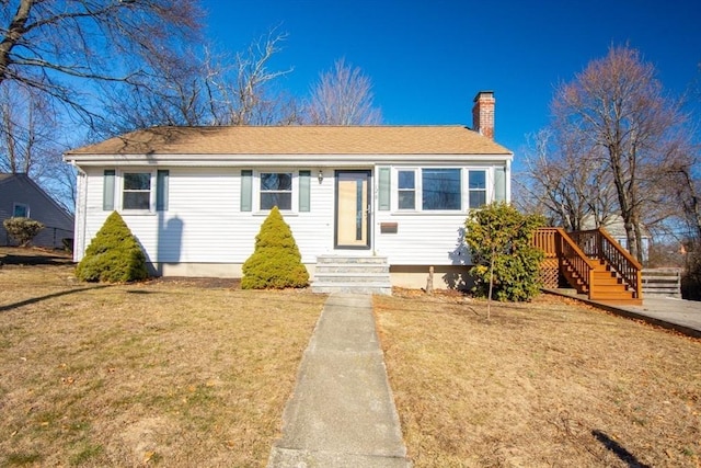 view of front of home with a front lawn