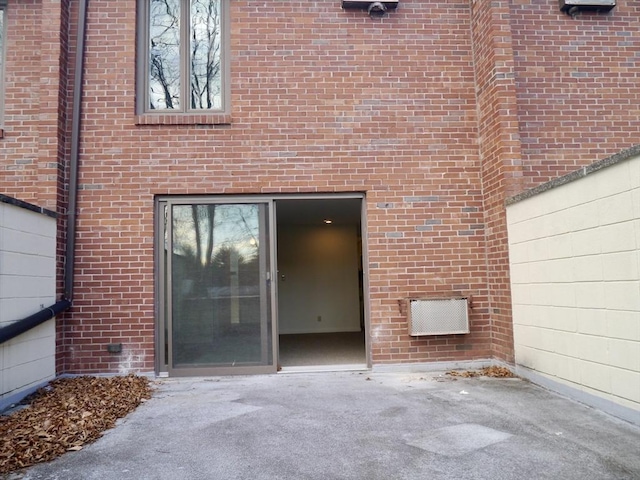 doorway to property featuring fence