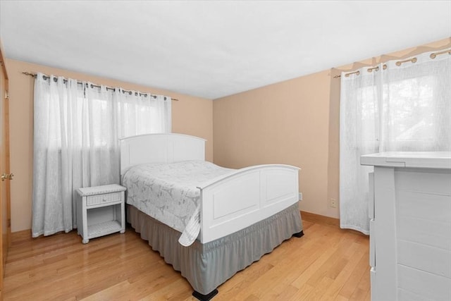 bedroom featuring light wood-style floors