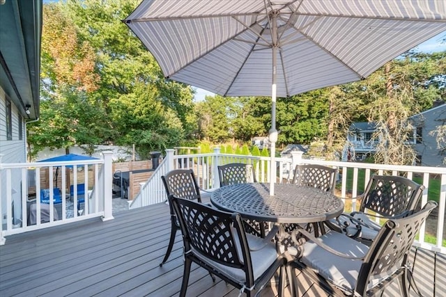 wooden deck with outdoor dining space