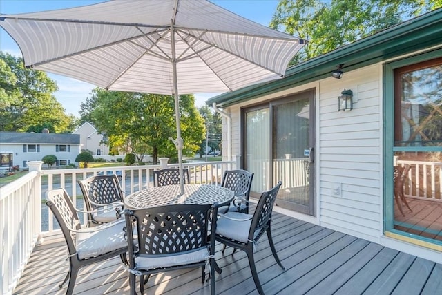 deck featuring outdoor dining area