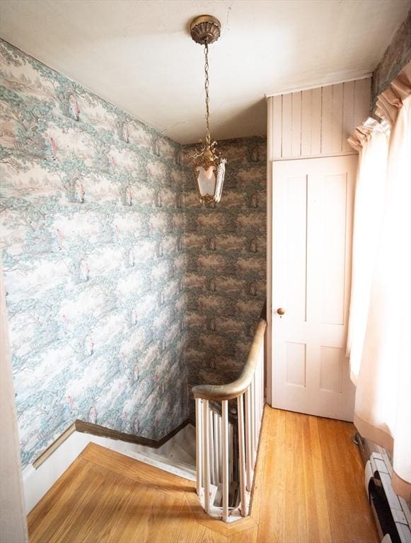 102 Margin St, Salem, MA 01970 - staircase with a baseboard heating unit, wood finished floors, and baseboards