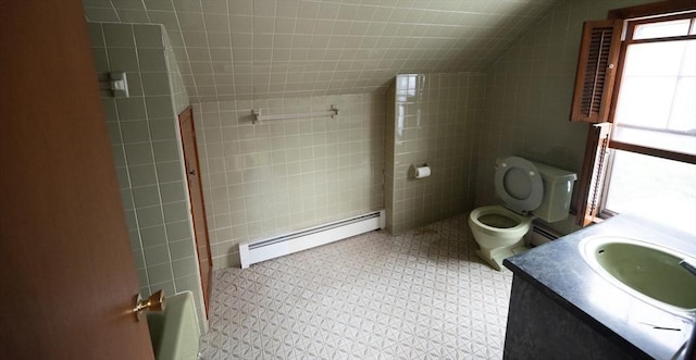 102 Margin St, Salem, MA 01970 - full bath with a baseboard heating unit, tile walls, vanity, toilet, and vaulted ceiling