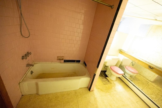 102 Margin St, Salem, MA 01970 - bathroom featuring a baseboard heating unit, toilet, bathing tub / shower combination, and tile patterned floors