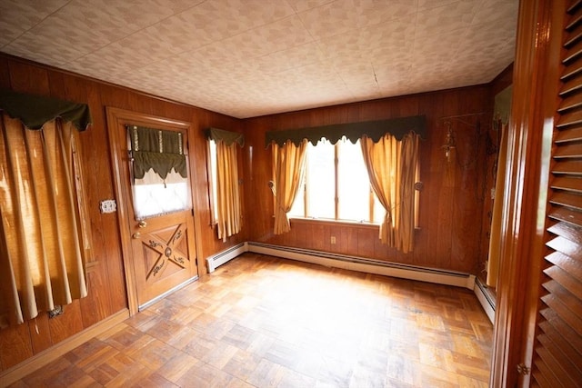 102 Margin St, Salem, MA 01970 - empty room with wooden walls, baseboards, and baseboard heating