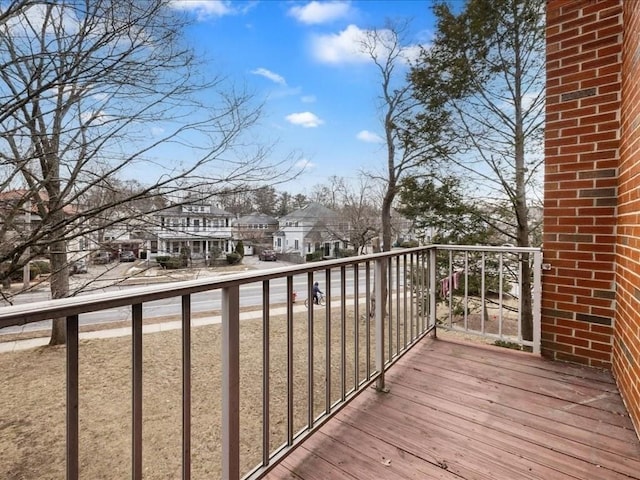 wooden deck featuring a residential view