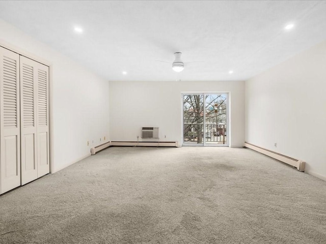 unfurnished bedroom with carpet floors, a baseboard radiator, recessed lighting, and a wall mounted AC